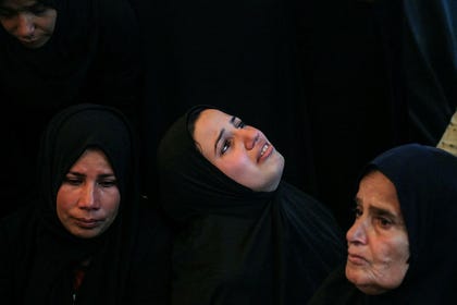 Palestinian women grieving in Khan Yunis, Gaza, Thursday.