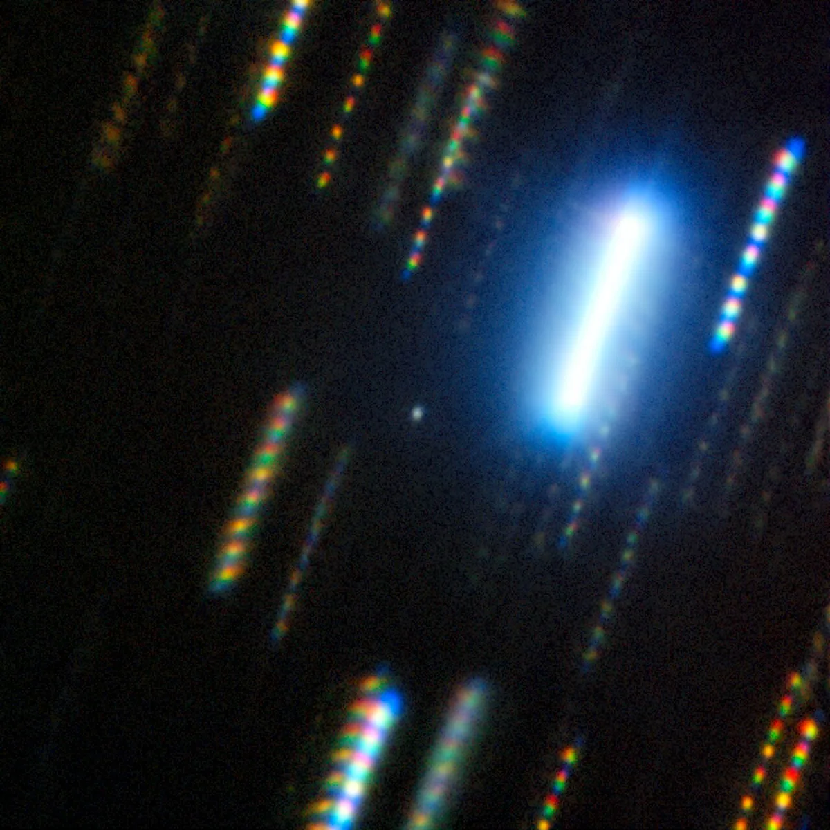 Image of asteroid 2024 YR4 captured with the Gemini South telescope in Chile on 7 February 2025, The asteroid is the faint dot in the centre, while the streaks of light are the apparent motion of background stars caused by the long exposure image. Credit: International Gemini Observatory/NOIRLab/NSF/AURA/M. Zamani