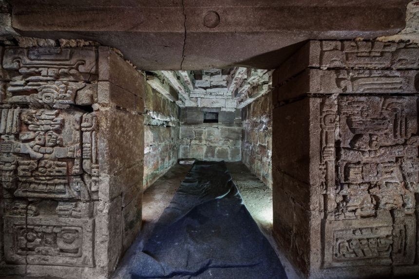 The threshold to the burial chamber is decorated with complex carvings.