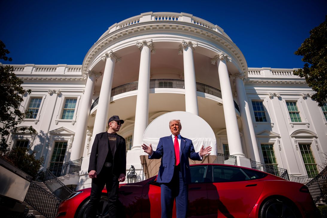President Donald Trump, accompanied by Elon Musk, speaks next to a Tesla Model S on the South Lawn of the White House on March 11, 2025.