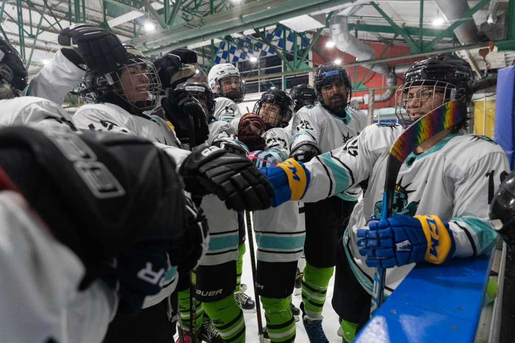 Members of a New York City Pride Hockey Alliance team prepare to play a game at Chelsea Piers