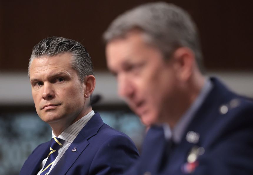 Secretary of Defense Pete Hegseth listens as Gen. Dan Caine testifies before the Senate Armed Services Committee on June 18, 2025.