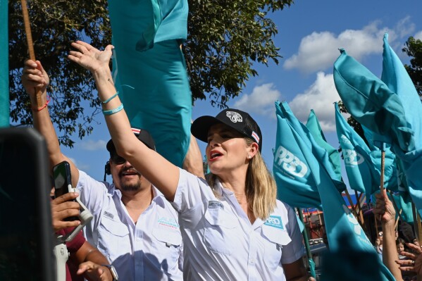 Costa Rican presidential candidate Laura Fernandez greets supporters during a campaign rally in San Jose, Costa Rica, Saturday, Jan. 24, 2026. (AP Photo/Carlos Gonzalez)