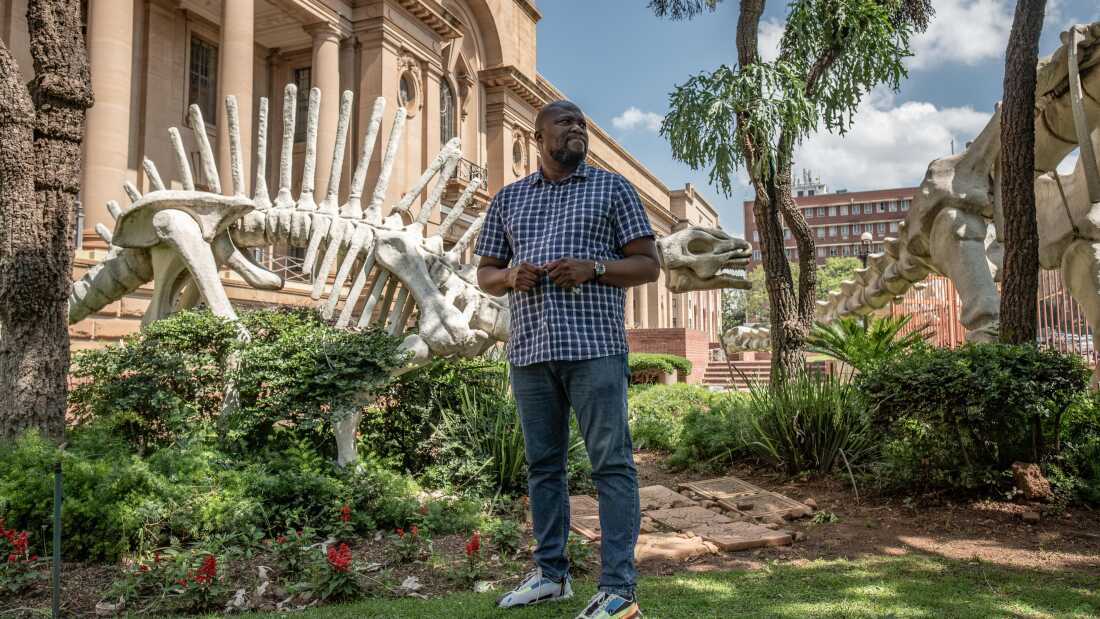 Paleontologist Lazarus Kgasi in front of the Ditsong National Museum of Natural History in Pretoria, South Africa, where he works as a laboratory manager and junior curator. Kgasi, who began working on fossil sites as a hired labourer with no knowledge at all of fossils, has over time emerged as a prominent figure in South African paleontology, and one of only a handful of Black South Africans in what remains an overwhelmingly White-dominated field.