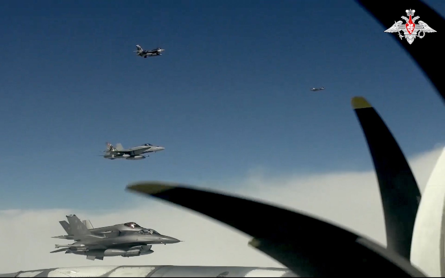 A screen grab taken from a video released by the Russian Defense Ministry shows Russian Tu-95MS strategic bombers and Chinese H-6K strategic bombers conducting joint patrols over the Chukchi Sea, the Bering Sea, and the northern Pacific Ocean on July 25, 2024.