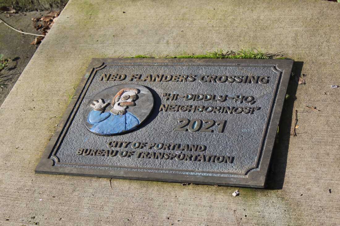 A plaque on the sidewalk at one end of Ned Flanders Crossing in Portland (renamed by the local Bureau of Transportation from Flanders Crossing in 2021) shows how proud the city is of its connection to The Simpsons.