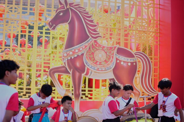 Local Chinese artists group gather to perform during celebration of the Lunar New Year of the Horse at Thuwunna stadium Saturday, Feb. 14, 2026, in Yangon, Myanmar. (AP Photo/Thein Zaw)