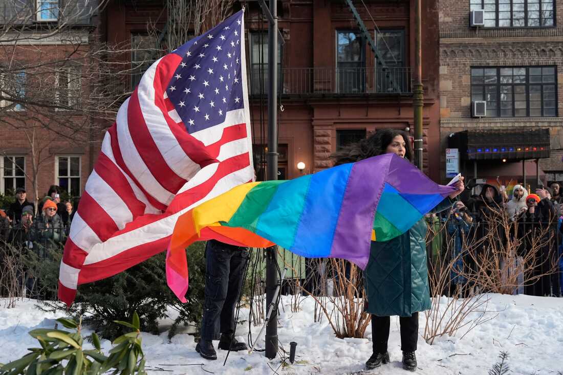 New York politicians and activists prepare to raise a rainbow flag on a pole in Christopher Park across the street from the Stonewall Inn, Thursday, Feb. 12, 2026, in New York, a few days after it was removed by the National Park Service to comply with guidance from the Trump administration.