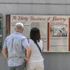 Tourists read a display titled "The Dirty Business of Slavery" at the President's House in Philadelphia on Aug. 9. Thirteen separate panels at the site are under review by the National Park Service for potential removal or editing.
