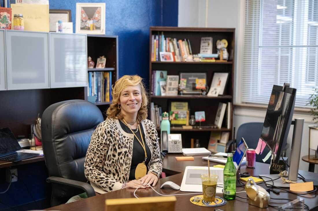 Hollie Smith, the executive principal of the Academy @ Shawnee, sits at a desk in an office.