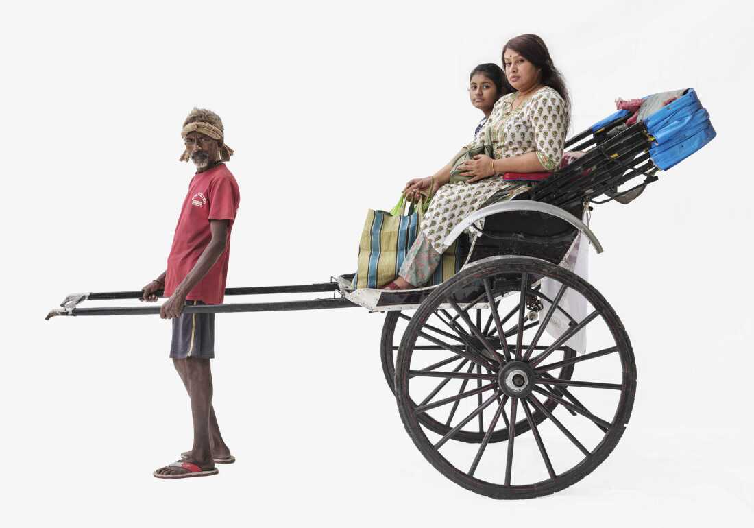 Dinu pulls a rickshaw in Kolkata, India.