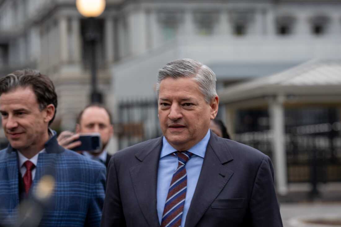 Netflix CEO Ted Sarandos departs the White House on Wednesday. Sarandos was there to discuss Netflix's bid for Warner Bros. just hours before Warner announced its preference for Paramount.