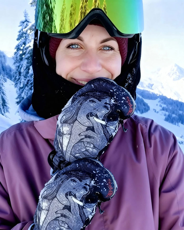 Smiling climber wearing reflective goggles and gloves with mountain scenery, related to climber's heartbreaking last words. Smiling climber wearing reflective goggles and gloves with mountain scenery, related to climber's heartbreaking last words.