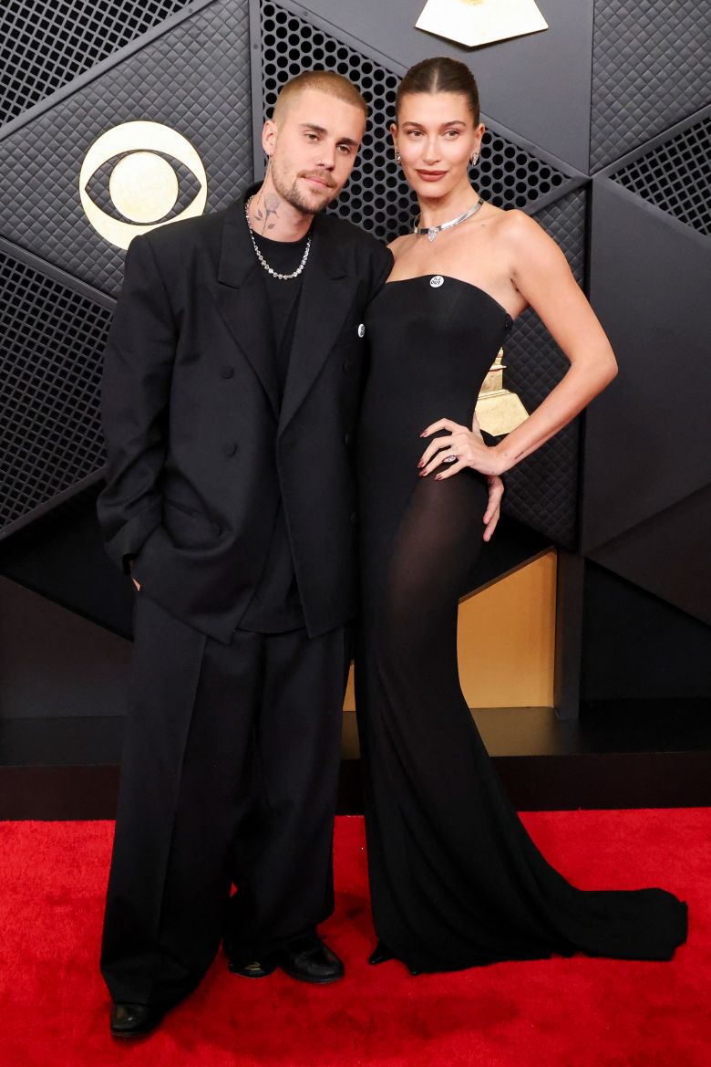 Justin and Hailey Bieber, both in all-black, were among several attendees seen wearing “ICE Out” (or “Be Good”) badges.