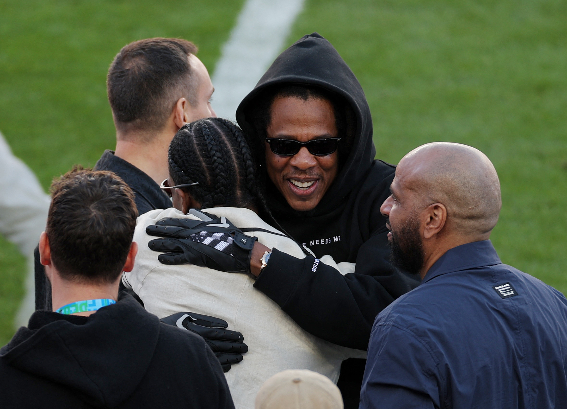 Jay-Z and Travis Scott on the field prior to Super Bowl LX between the New England Patriots and the Seattle Seahawks at Levi's Stadium on February 08, 2026 in Santa Clara, California.