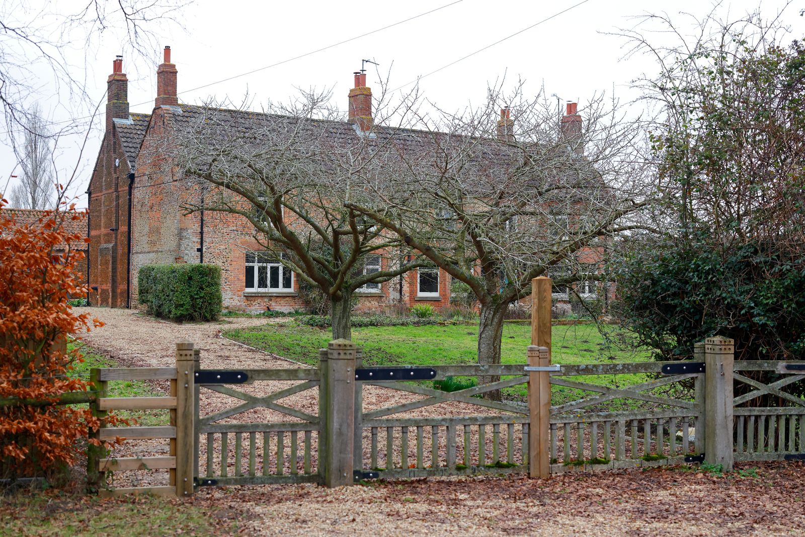 Image may contain Nature Outdoors Yard Architecture Building Picket Fence Housing and Backyard