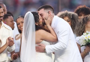 SANTA CLARA, CALIFORNIA - FEBRUARY 08: A couple marries during the Bad Bunny performance onstage at the Apple Music Super Bowl LX Halftime Show at Levi's Stadium on February 08, 2026 in Santa Clara, California.