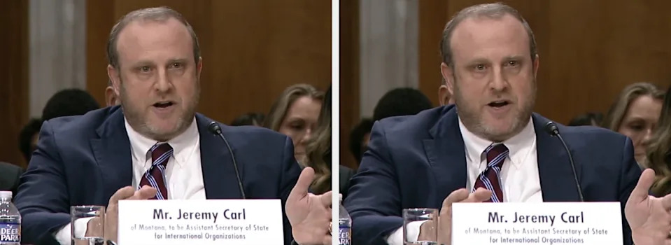 A man in a suit and tie is speaking at a formal hearing, labeled as "Mr. Jeremy Carl," seated at a table with microphones