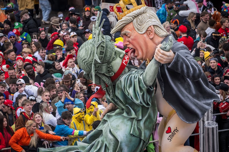 MAINZ, GERMANY - FEBRUARY 16: A carnival float shows US President Donald Trump dancing provocatively with Miss Liberty under the slogan “Stormy Donald,” during the annual Rose Monday parade on February 16, 2026 in Mainz, Germany. Rose Monday is the highlight of Carnival season, especially in western Germany, where parade float designers are famous for often searing and irreverent depictions of German and foreign politicians. (Photo by Thomas Lohnes/Getty Images)