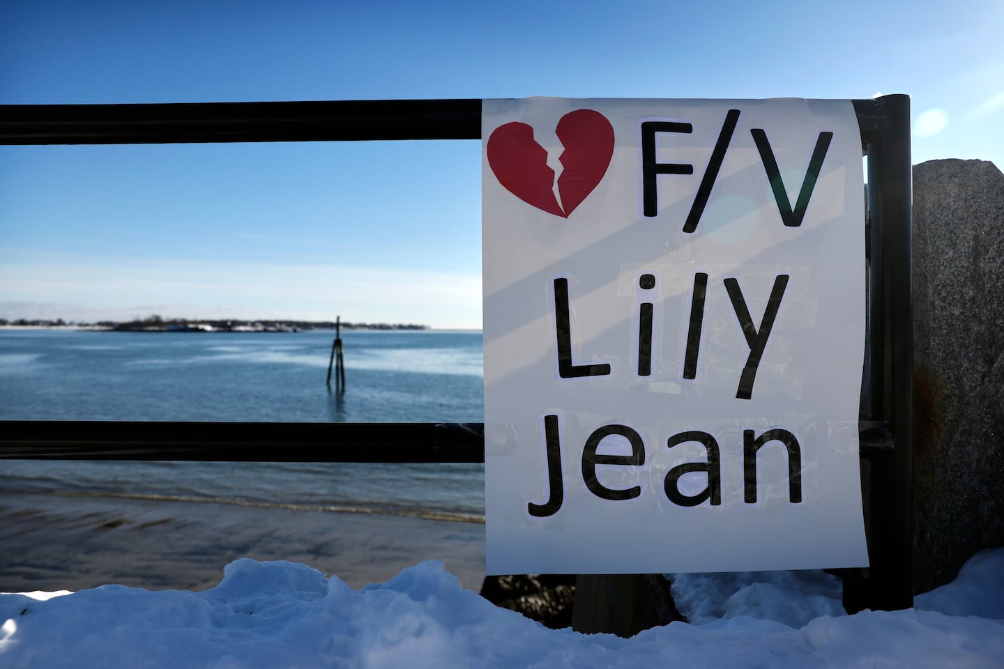 A placard honoring the crew of the Lily Jean was displayed at the Gloucester Fisherman's Memorial Saturday, overlooking Gloucester Harbor. 
