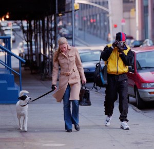 John F. Kennedy Junior and wife Carolyn Bessette and dog take a stroll in Tribeca. John takes photos with a Leica camera of the photographers. (Photo by Lawrence Schwartzwald/Sygma via Getty Images)