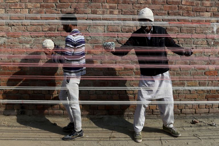Workers prepare and arrange kite strings during preparations for the upcoming Basant Festival in Lahore, Pakistan, on January 17, 2026. (Photo by Murtaza Ali/NurPhoto via Getty Images)
