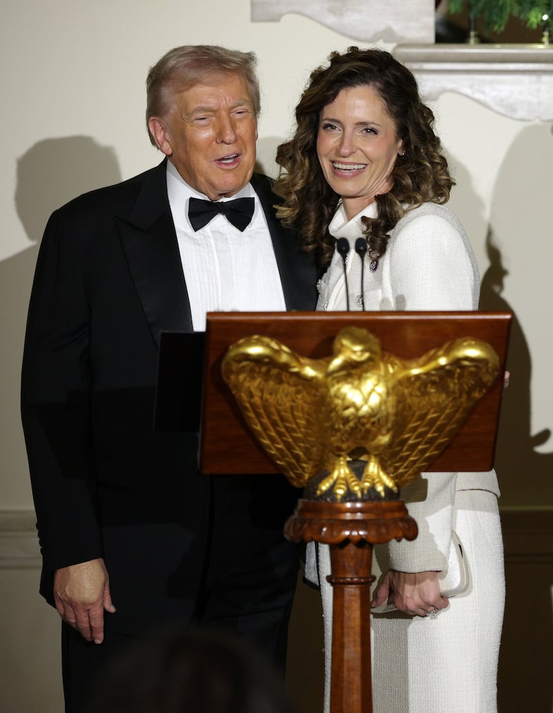 Donald Trump stands with U.S. Rep Julia Letlow at the White House on December 11.