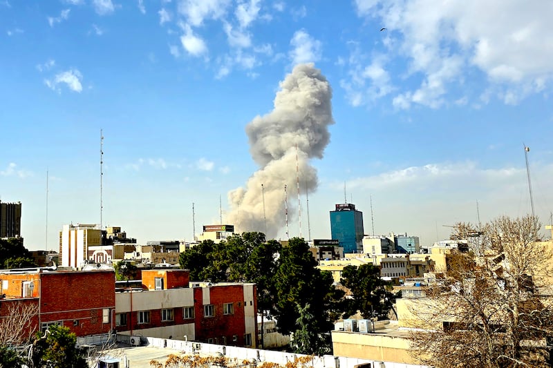 A plume of smoke rises after an explosion on February 28, 2026 in Tehran, Iran. After explosions were seen in the Iranian capital, the office of the Israeli Defense Minister issued a statement saying it had launched a preemptive strike against the country.