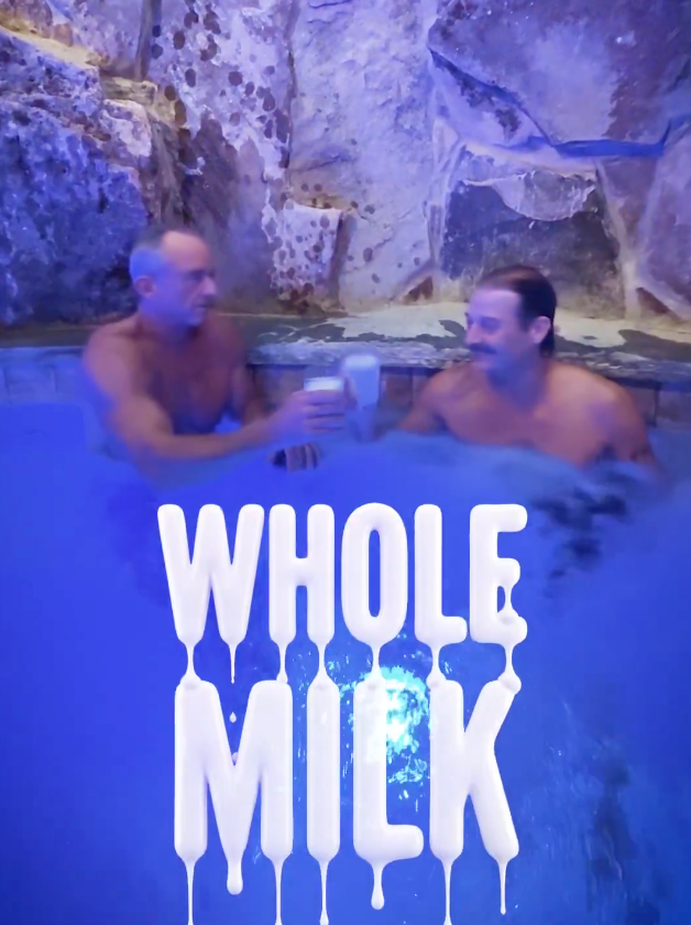 Kennedy and Kid Rock drink glasses of milk in a pool