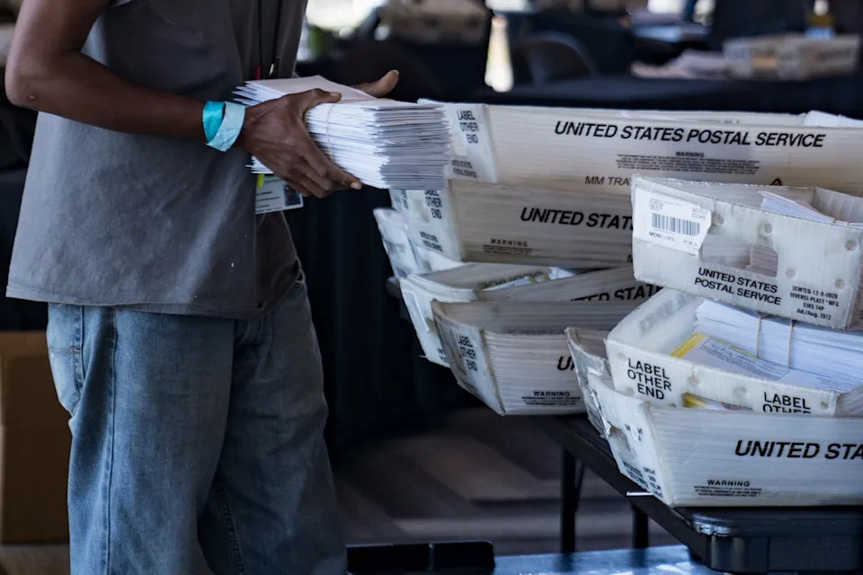 An election worker processes absentee ballots at State Farm Arena on November 2, 2020 in Atlanta, Georgia. Atlanta is one of the cities that President Donald Trump called ‘corrupt’ in February 2026 amid his calls for Republicans to ‘take over’ national elections (Getty Images)