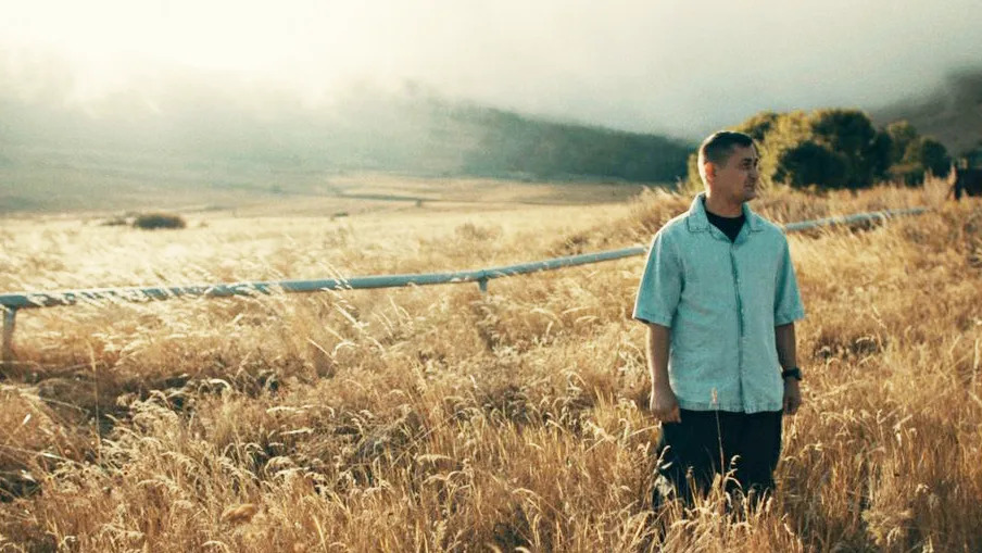 Ilya is seen standing in a field, in an undisclosed location.