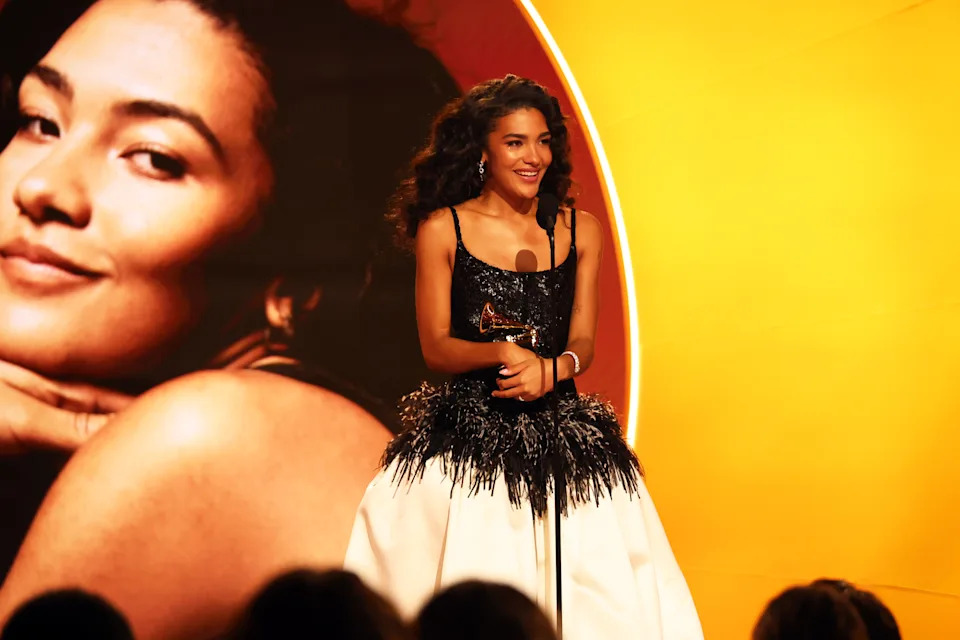 Olivia Dean accepts the Best New Artist award at the Grammys.