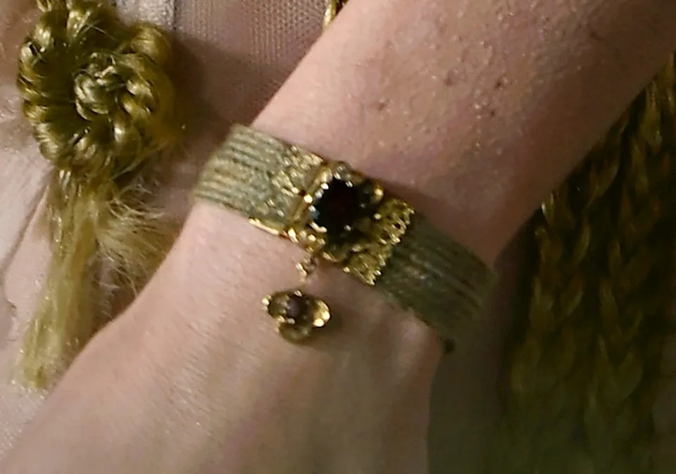 On the actress’ wrist was a replica of an antique bracelet crafted from Emily and Anne Brontë’s hair. Gareth Cattermole/Getty Images