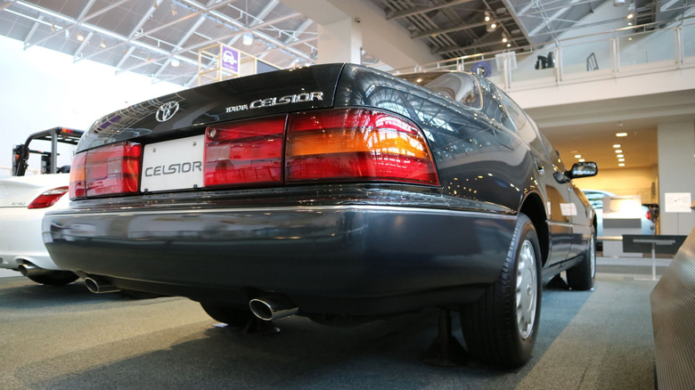 A black Toyota Celsior seen from the rear.