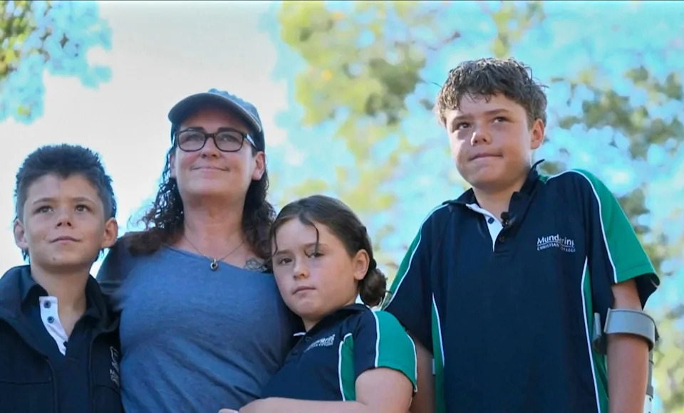 This image taken from video shows Austin Appelbee, right, posing with his family in Gidgegannup, Australia, Tuesday Feb. 3, 2026. / Credit: ABC/AP