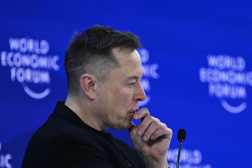 Elon Musk delivers a speech during the 2026 World Economic Forum Annual Meeting in Davos, Switzerland.