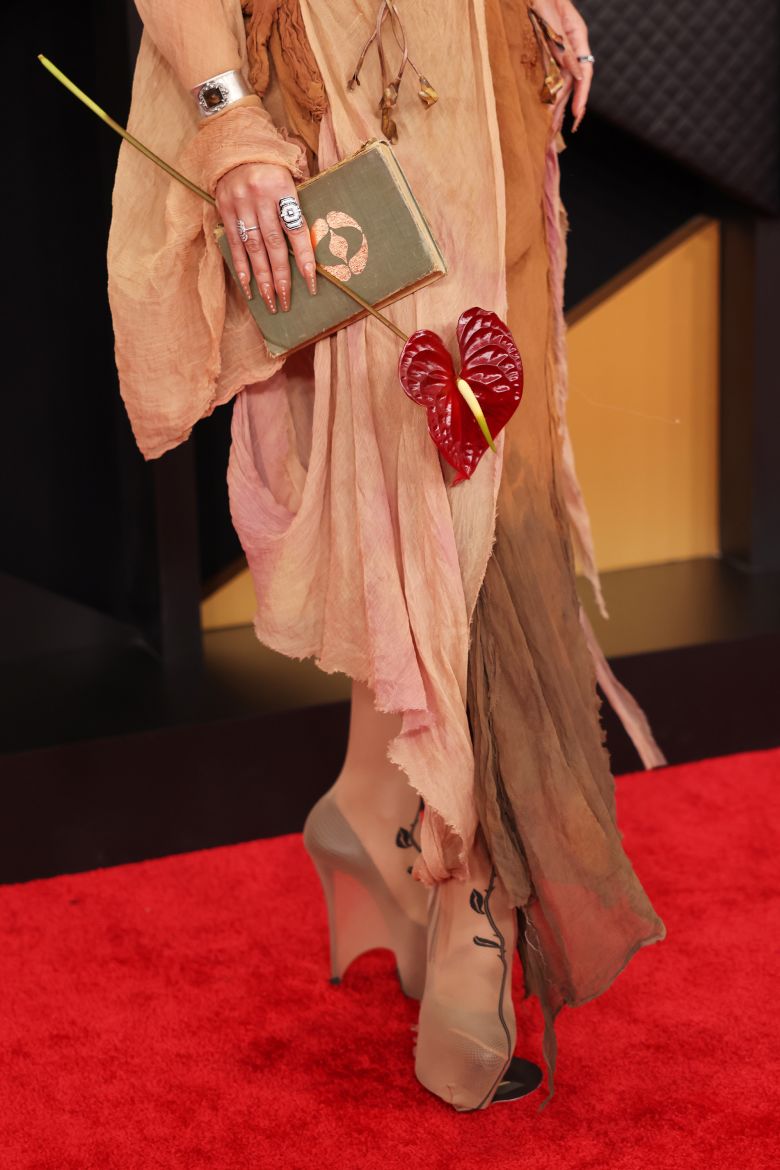 The singer accessorized with an anthurium flower and a book — which, she told Variety, contained the “lore of 'Eusexua,'” her latest album.