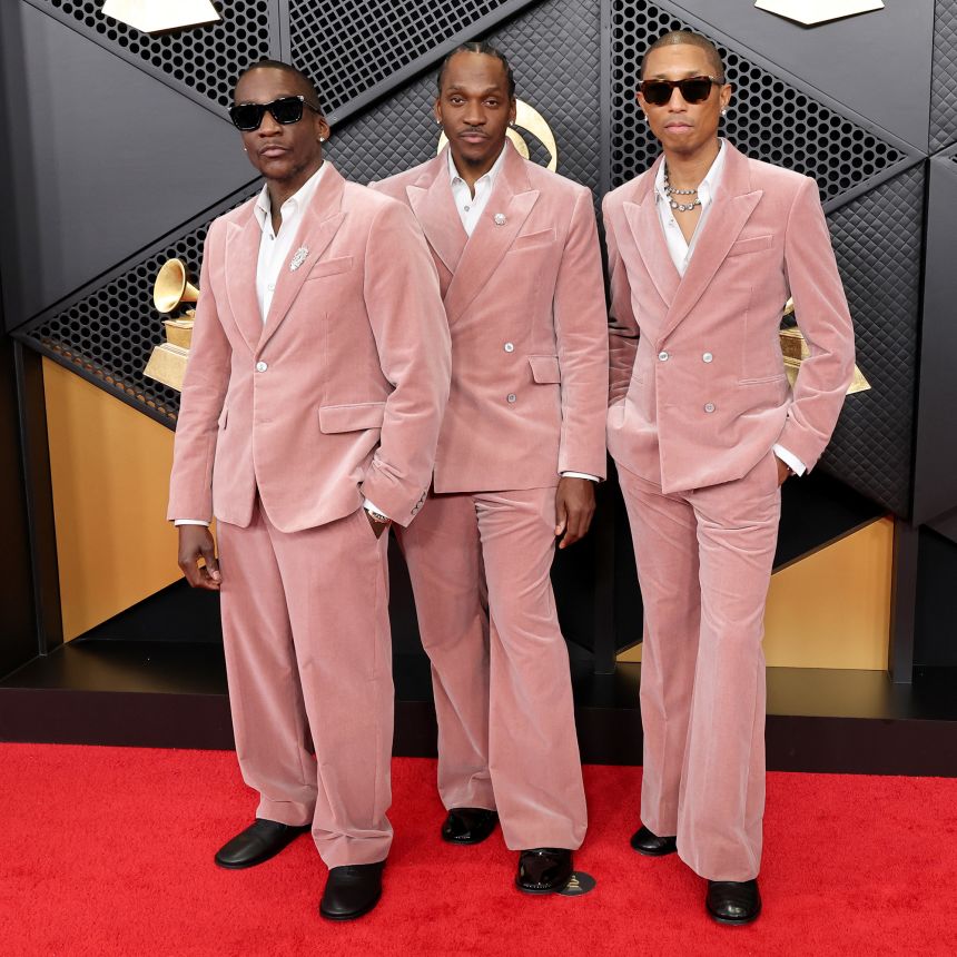 Rap duo Clipse (Malice and Pusha T) arrived alongside Pharrell Williams. The trio wore coordinated dusty-pink velvet suits by Louis Vuitton, for whom Williams serves as creative director for menswear.