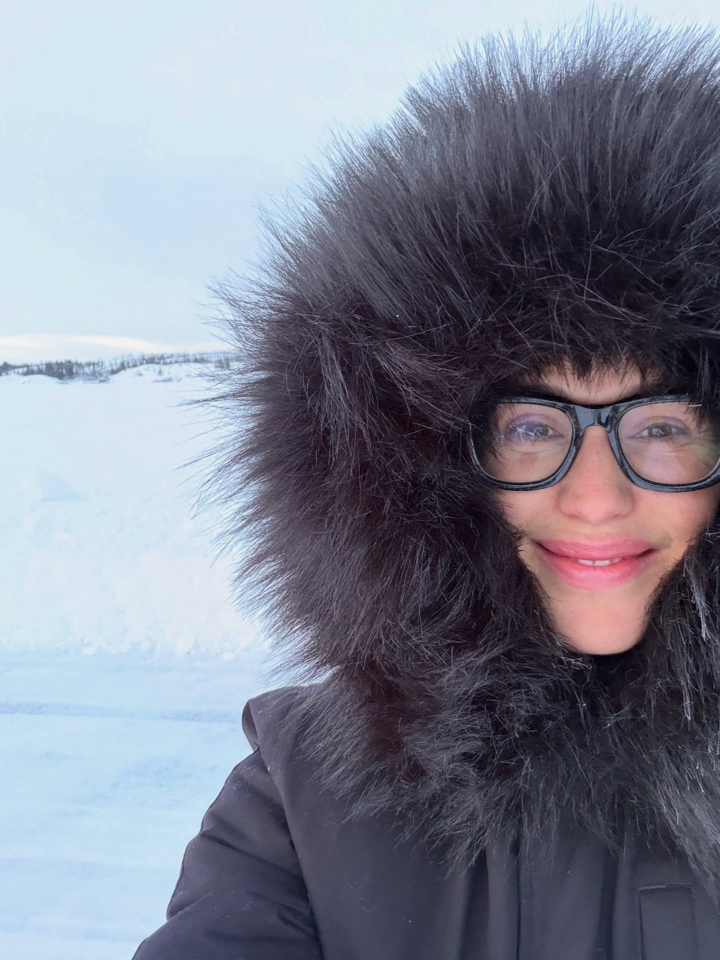 Jennifer Garner gets swallowed up in her furry hood.