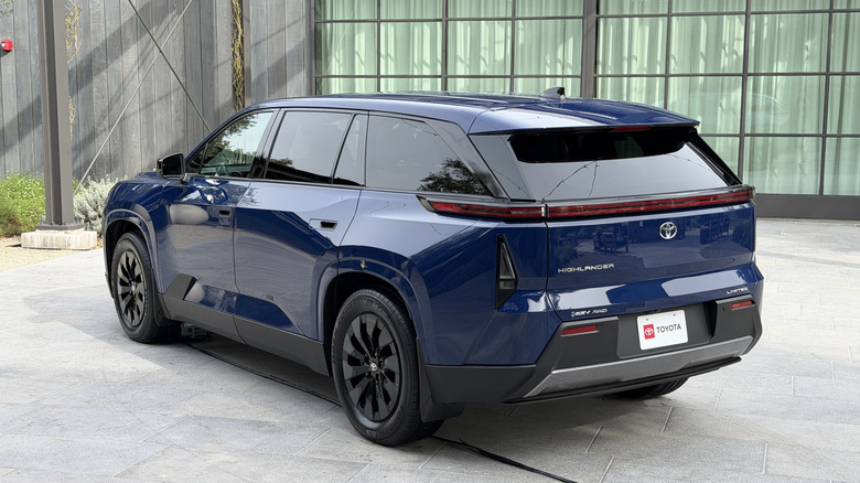 Rear 3/4 view of a blue 2027 Toyota Highlander EV