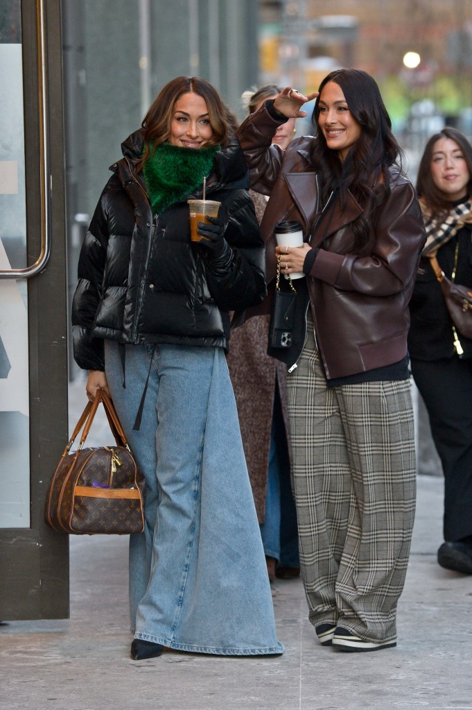 Nikki Bella and Brie Bella kept it bundled up while arriving at "Good Morning America" in NYC.