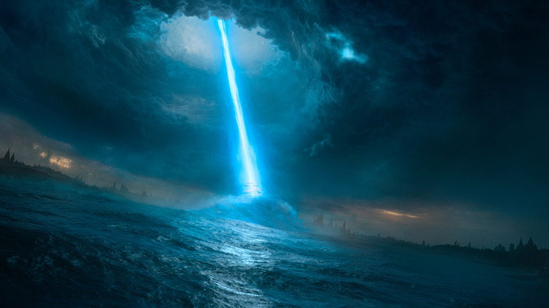 A blue energy beam from the sky hits an icy ocean in the middle of a storm in Varanasi