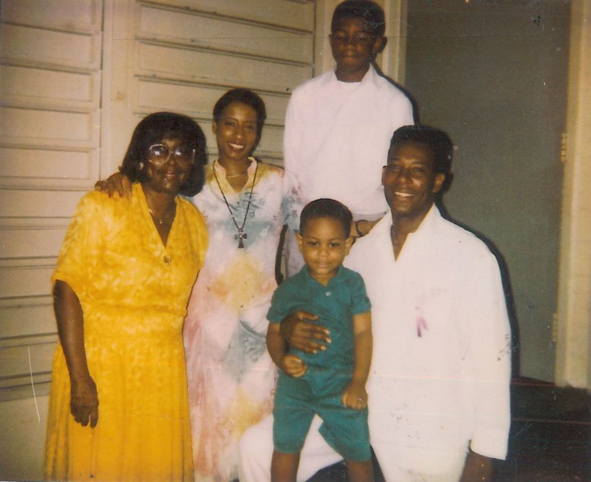 Charles Burton poses with his family in a photograph provided by his attorneys.