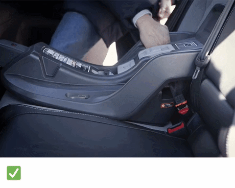 Kanagawa demonstrates what a securely fastened car seat base should look like. She's tugging at the base, and it's not moving.