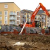 Construction workers build new houses
