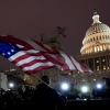 Protesters hold flags as they are pushed back by police on Jan. 6, 2021, after President Trump supporters stormed the U.S. Capitol.