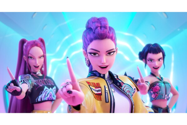 This image released by Netflix shows characters, from left, Mira, Rumi, Zoey in a scene from "KPop Demon Hunters." (Netflix via AP)
