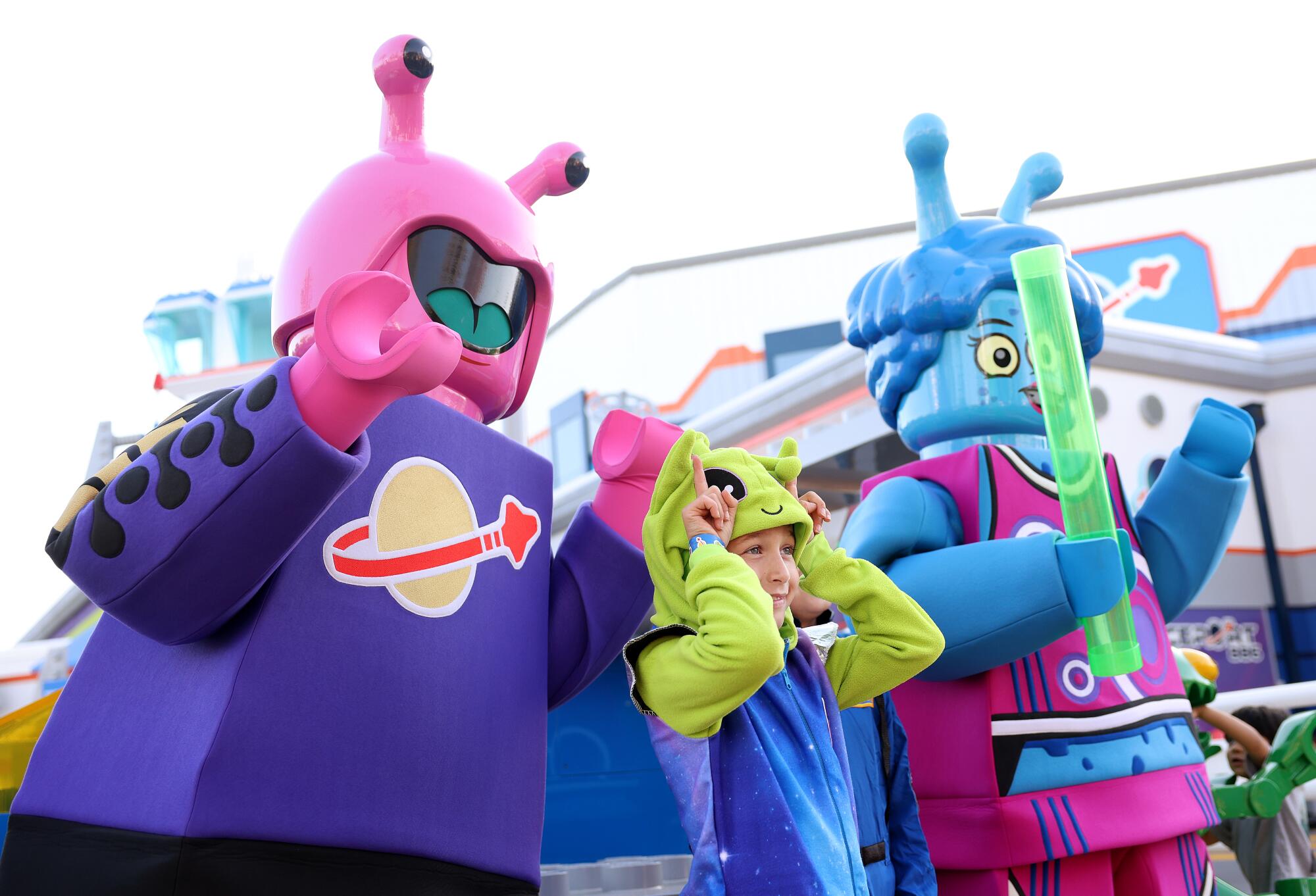 Austin Rafie, 7, poses with characters at Lego Galaxy, a new space-themed land, at Legoland in Carlsbad.