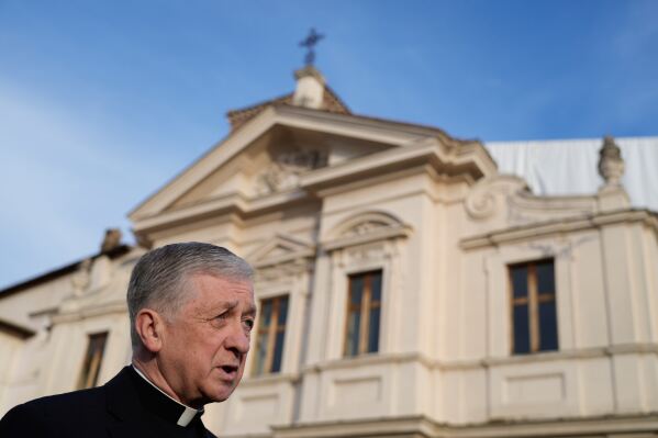 Archbishop of Chicago, Cardinal Blase Cupich, answers a journalist's question during an interview with The Associated Press, in front of St. Bartholomew church, in Rome, Thursday, Oct. 9, 2025. (AP Photo/Gregorio Borgia, File)
