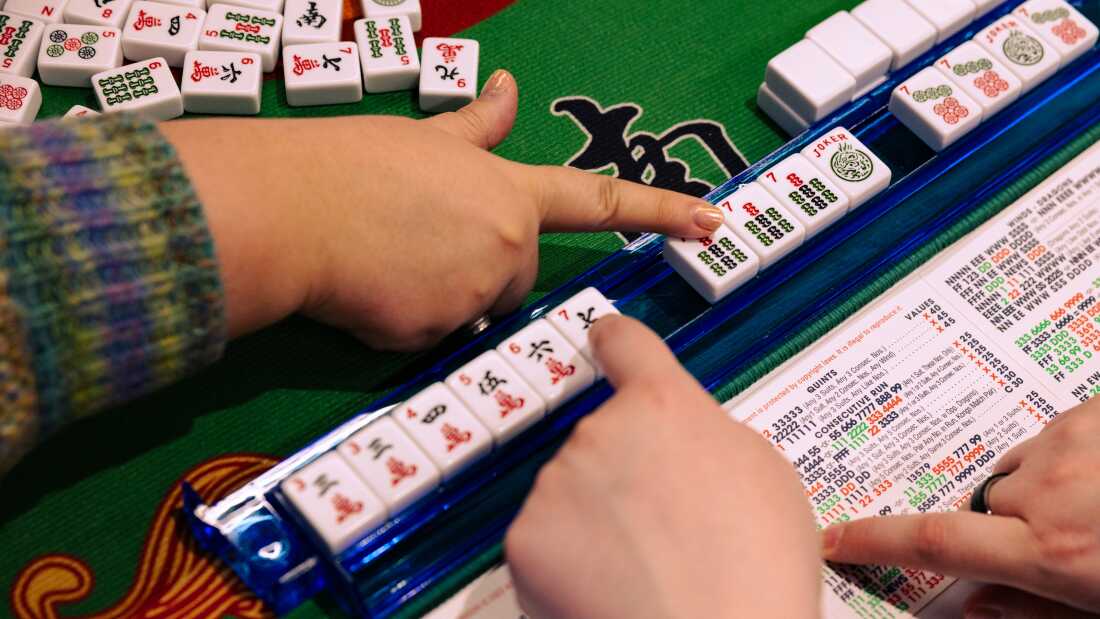 People learn and play American Mahjong at the Capital Jewish Museum in Washington, D.C. In-person meetups to play Mahjong are growing in popularity along with interest in the game.